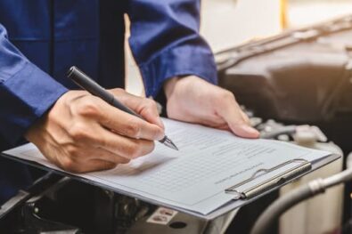 mechanic checking mot