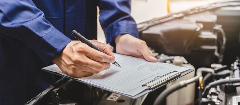 mechanic checking mot