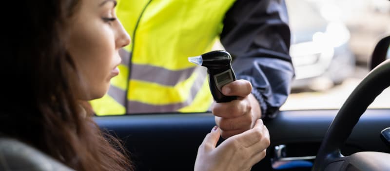 Woman doing breathalyser