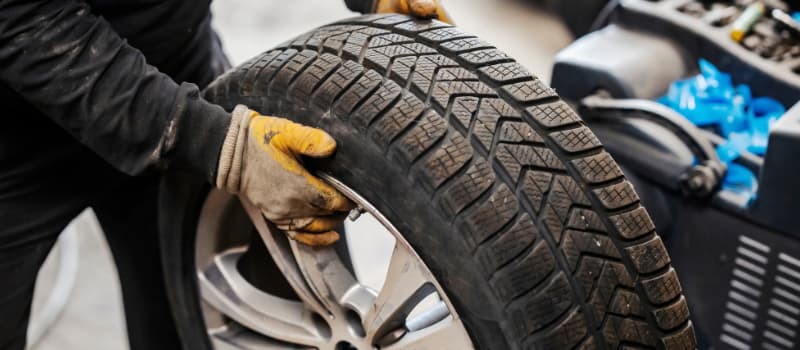 Mechanic with tire