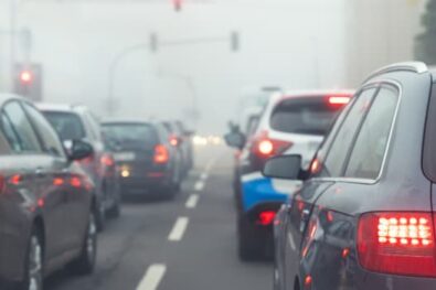 car on traffic lights on a cold and foggy day