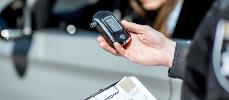 police checking breathalyzer