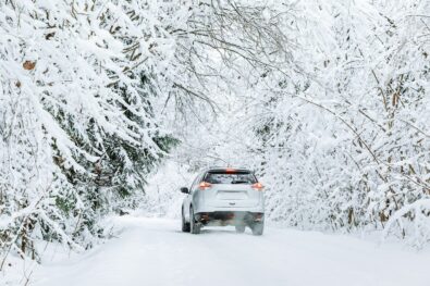 car on a winter road covered in snow